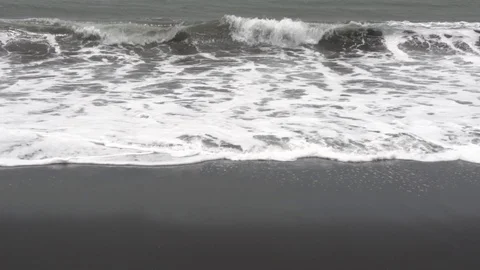 Waves on the black sand beach in Bali. Stock Footage 104404000