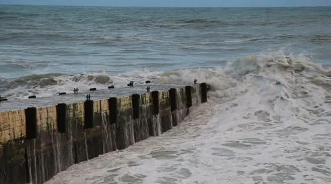 Waves of the Black sea during a storm breaking on pier on beach in Sochi Vidéo 48986296