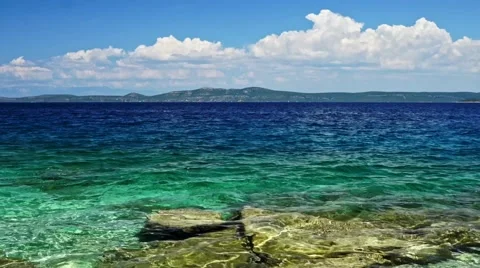 Waves on the blue sea with rock Stock Footage 66908805