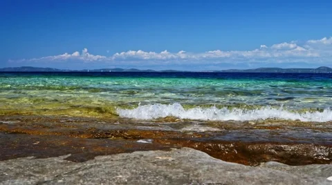 Waves on the blue sea with rock Stock Footage 66908867