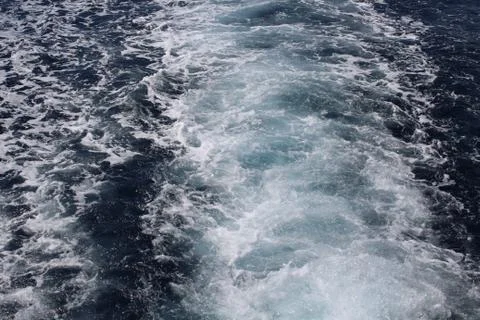 Waves from a boat Stock Photos