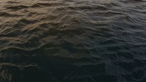Waves from a boat on the river soil before sunset Stock Footage 112543178