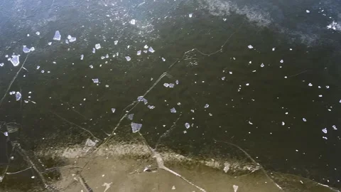 Waves from a boat sailing on a cold winter river Stock Footage 320996286