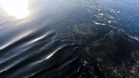 Waves from a boat sailing on a cold winter river Stock Footage 324855087