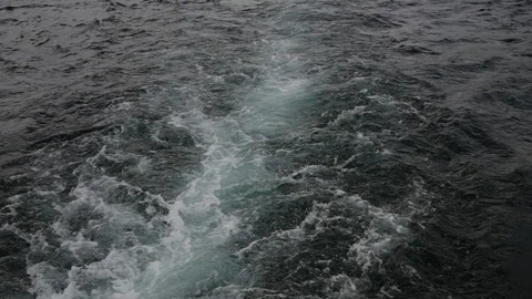 Waves from a boat on the surface of the lake Video stock 284629602