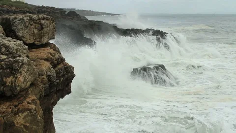 Waves break against rocks. Atlantic coast. Portugal. Near Cape Roca Stock-Footage 74556417