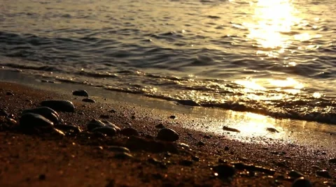 Waves break against shoreline, close up, sunset Stock-Footage 48751018