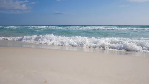 Waves break on an Empty Beach in Seaside, Florida Stock Footage 128546744