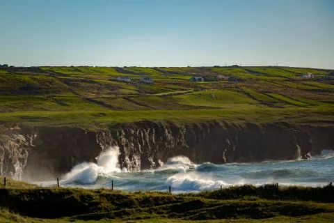 Waves Break on Irish Coastal Cliffs Stock Photos