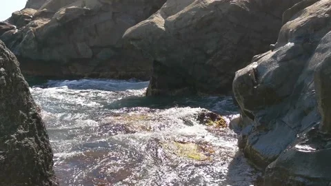 Waves break on large sea rocks Stock Footage 140332662