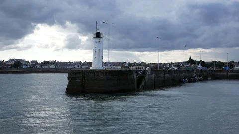 Waves break at lighthouse Stock Footage 79628738