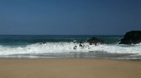 Waves Break over rock Stock Footage 619067