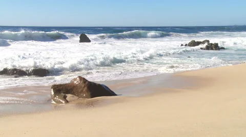 Waves break onto a pristine beach Stock Footage 43097881