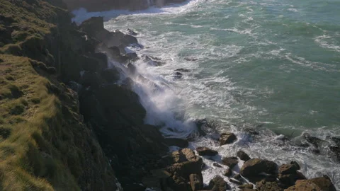 Waves break on the rocks of a cliff, in New Zealand Stock Footage 219719253