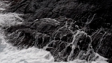 Waves break on the rocks Stock Footage 104756242