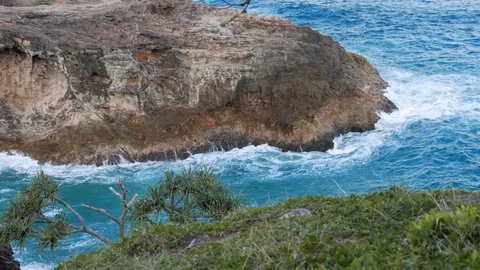 Waves break on the rocky coast Stock Footage 98416735
