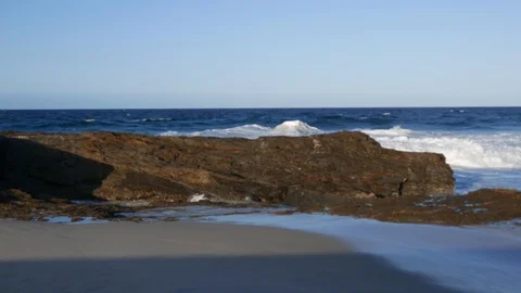 Waves break on rocky coast Stock Footage 119161417