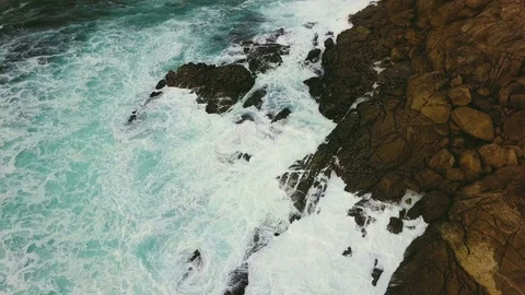 Waves break on the rocky shore Stock Footage 82308406