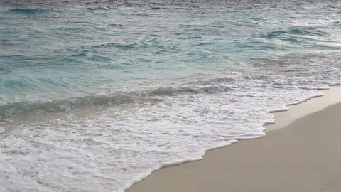Waves break on sandy beach at stormy day. Slow motion 240 fps Stock Footage 119150285