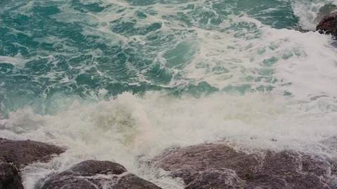Waves break on the shore and rocks Stock Footage 91187221