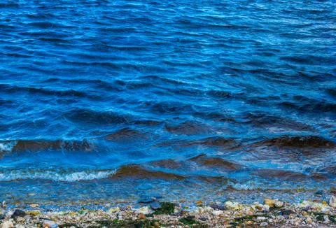 Waves break on the shore Stock Photos