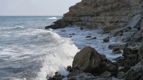 Waves break on the shore. Waves break on the rocks. Stock Footage 120747880