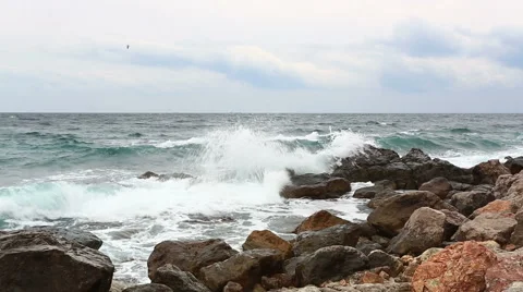 Waves break with splashes about big stones Stock Footage 47746365