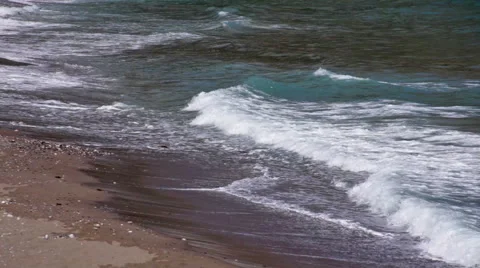  waves with breakers arriving on sandy beach Stock Footage 52980336
