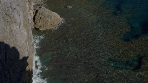 Waves Breaking Against Cliffs at Cape Hedo, Japan. Stock Footage 258331155