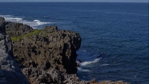 Waves Breaking Against Cliffs at Cape Hedo, Japan. Stock Footage 258331187