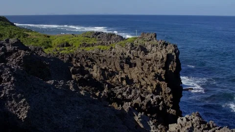 Waves Breaking Against Cliffs at Cape Hedo, Japan. Stock Footage 258331232