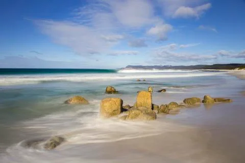 Waves breaking against the rocks on Friendly Beaches, Tasmania Stock Photos