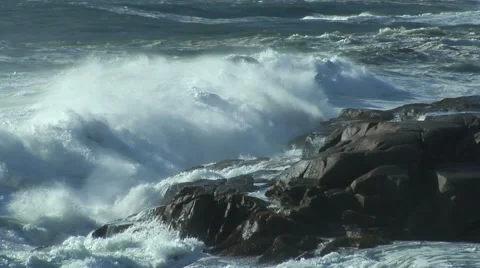 Waves breaking against rocks on ocean shoreline, storm surge Stock Footage 46539605