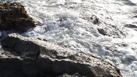Waves breaking against the rocks of Port Ginesta. Stock Footage 124470766