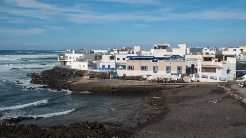 Waves breaking along the coastline at El Cotillo Fuerteventura Stock Footage 125757778