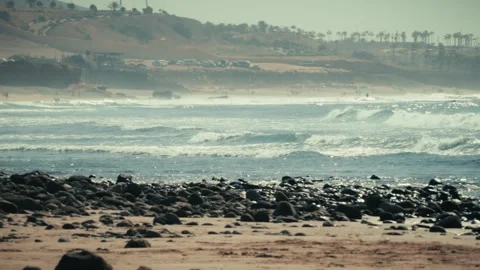 Waves Breaking Along the Rocky Shore at Imsouane, Morocco Stock Footage 346316885