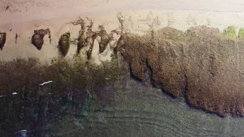 Waves breaking along a white sand beach in Bali Stock Footage 153724010