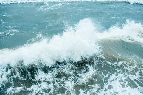 Waves Breaking and Spraying at High Seas and Strong Winds. Storm at the sea i Stock Photos