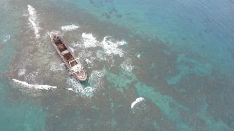 Waves Breaking around the abondoned ship Video stock 150382386