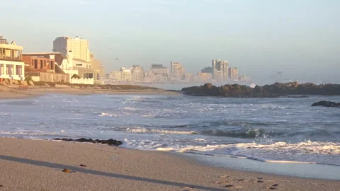 Waves breaking on the beach at Bloubergstrand Stock Footage 309650082