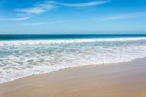 Waves breaking on beach with blue sky - Port Elizabeth, South Africa 写真素材