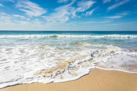 Waves breaking on beach with blue sky - Port Elizabeth, South Africa 写真素材