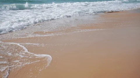 Waves breaking into the beach close-up shots. Stock Footage 156338103