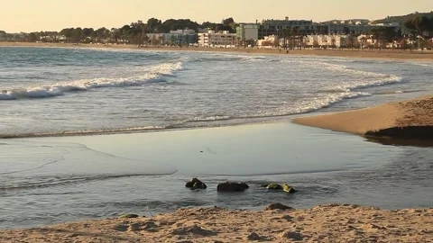 Waves breaking on the beach of Comarruga, Tarragona Stock Footage 330938536