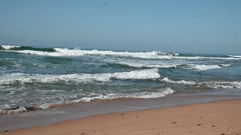 Waves breaking on a beach Stock Footage 336096014
