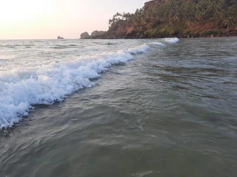 Waves breaking on the beach, goa  beach, waves on the beach. Stock Photos