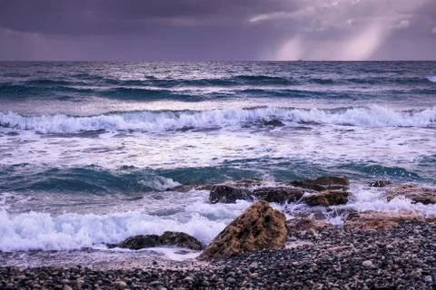 Waves breaking on the beach in Larnaca Stock Photos