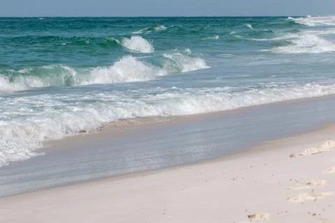 Waves breaking on the beach. Stock Photos