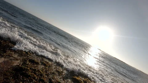 Waves breaking on beach rotating, slow motion 動画素材 133980156