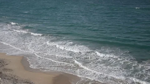 Waves breaking on the beach sand Stock-Footage 77716032